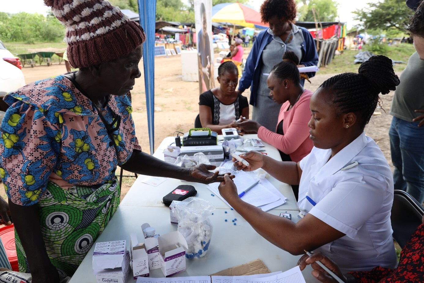 Community members attending the monthly market at Chiremwaremwa in rural Bikita district, receive education on NCDs and are screened for diabetes, March 2023. Photo: &copy; Laura Ruckstuhl