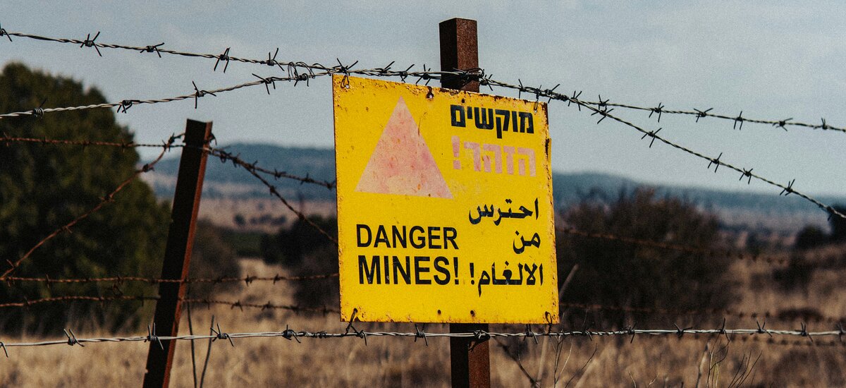 Cuts leave deadly mines in the ground and push hundreds of women out of work