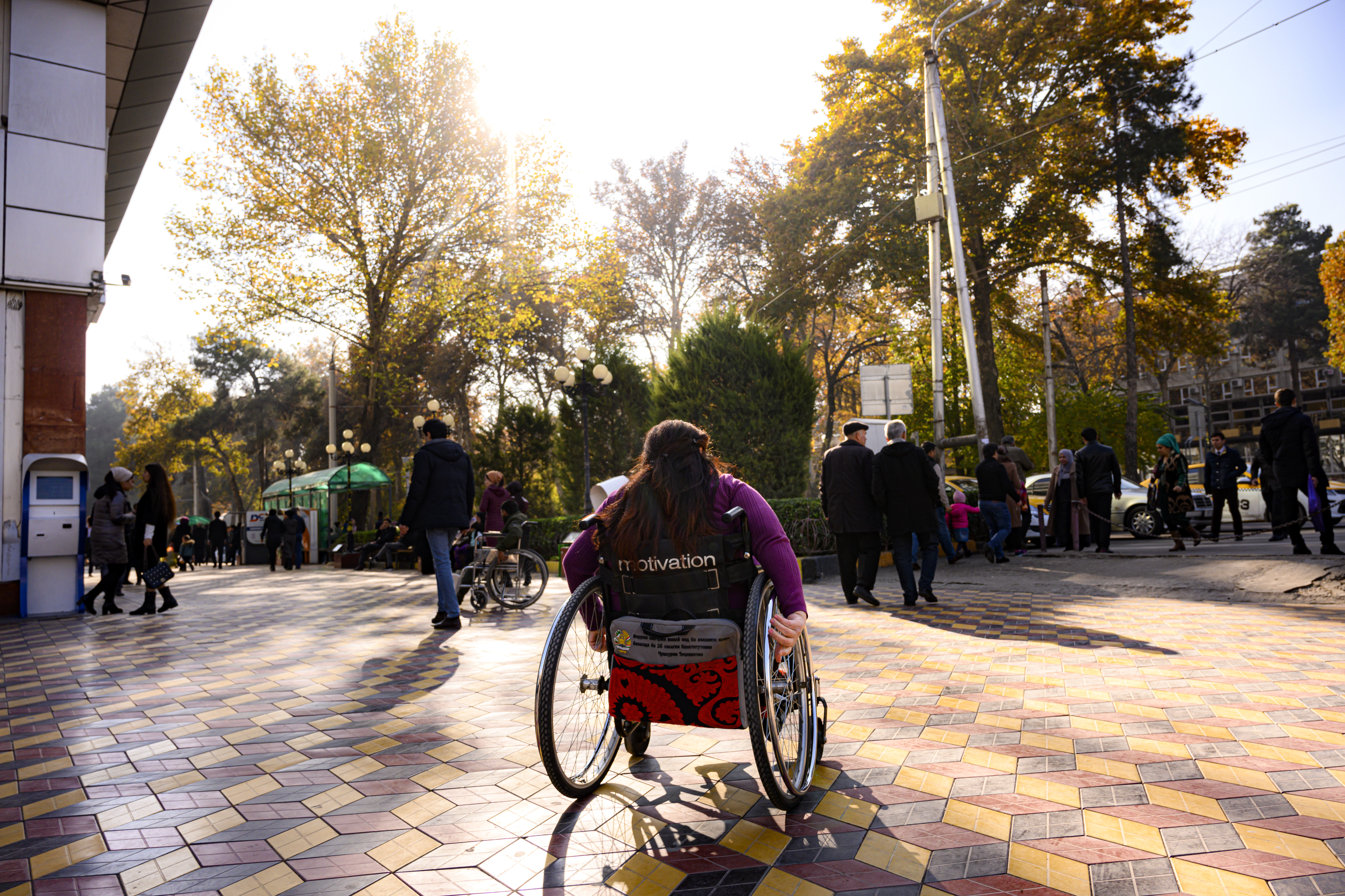 Patient (WHO Study Case) in her wheelchair within the urban environment of the city of Dushanbe in Tajikistan. Photo: &copy; WHO/ NOOR/ Sebastian Liste